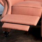 Fauteuil inclinable en tissu capitonné avec accents rivetées