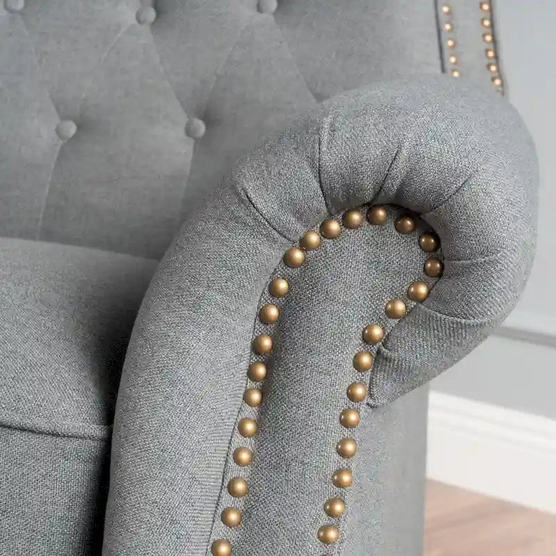 Fauteuil inclinable en tissu capitonné avec accents rivetées